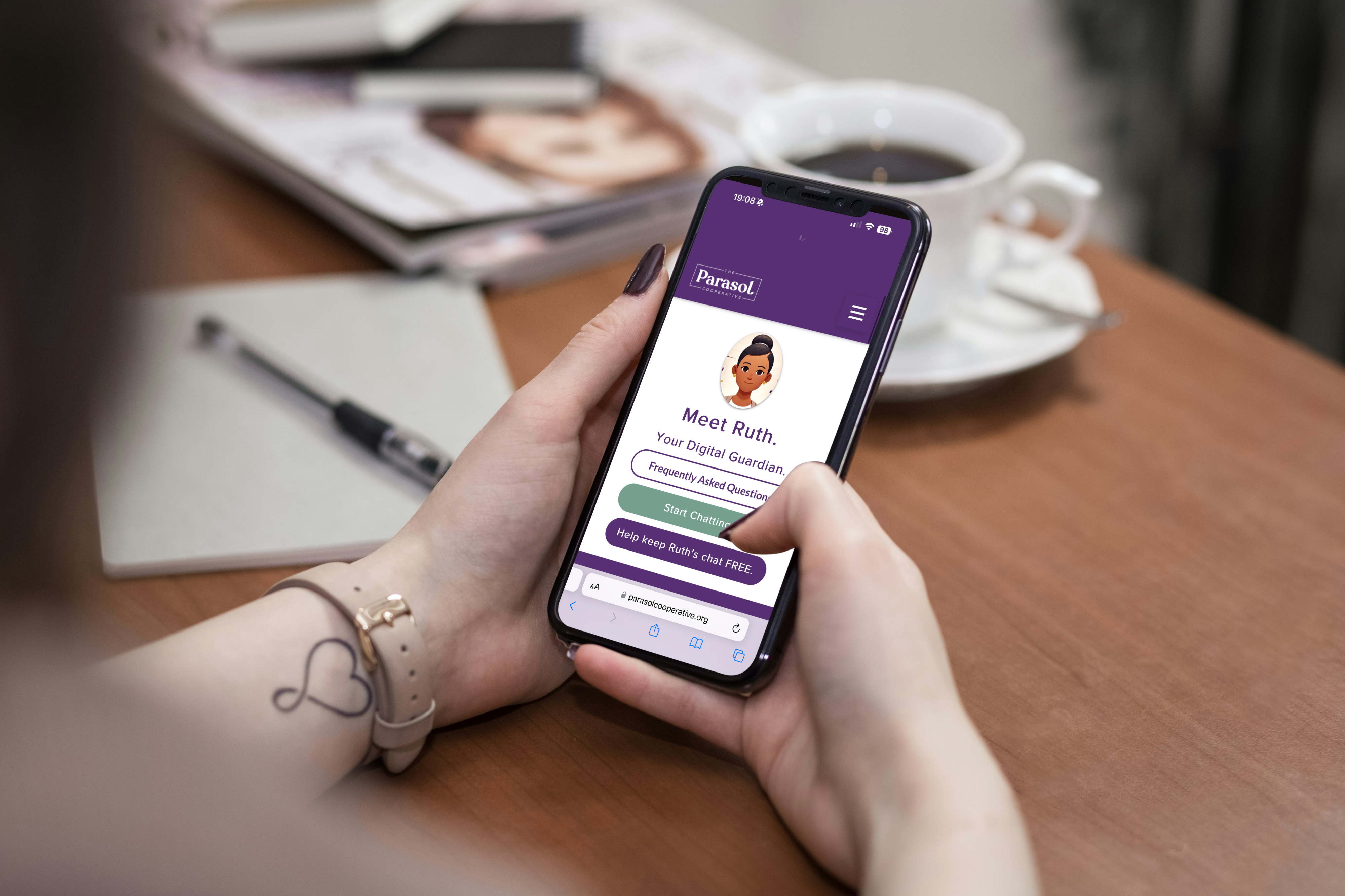 A woman holding a smart phone with the AI chatbot Ruth displaying on the screen